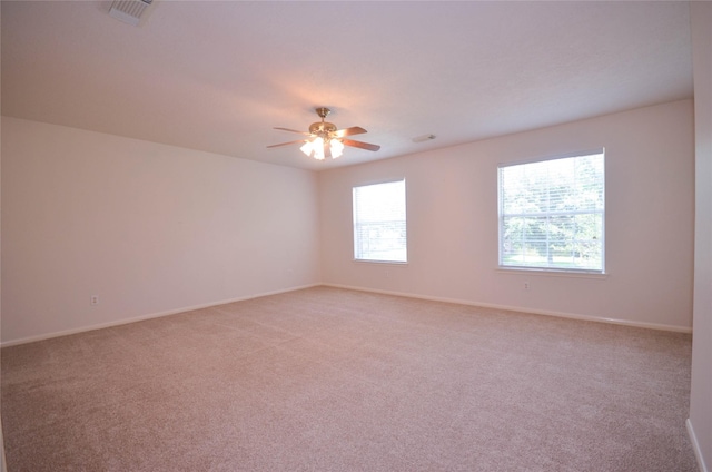 6906 Grant Dr, Magnolia, TX 77354 - spare room featuring light colored carpet and a ceiling fan