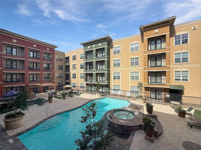 1711 Old Spanish Trl Unit 240, Houston, TX 77054 - view of swimming pool featuring a pool with connected hot tub and a patio