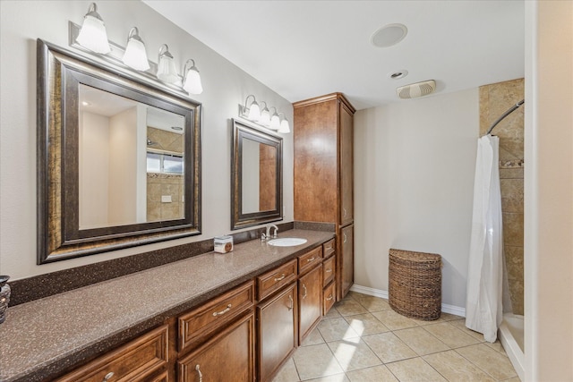 2826 Meadow Brook Ct, League City, TX 77573 - full bathroom featuring vanity, a tile shower, and tile patterned floors