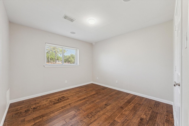 2826 Meadow Brook Ct, League City, TX 77573 - spare room featuring dark wood-type flooring and baseboards