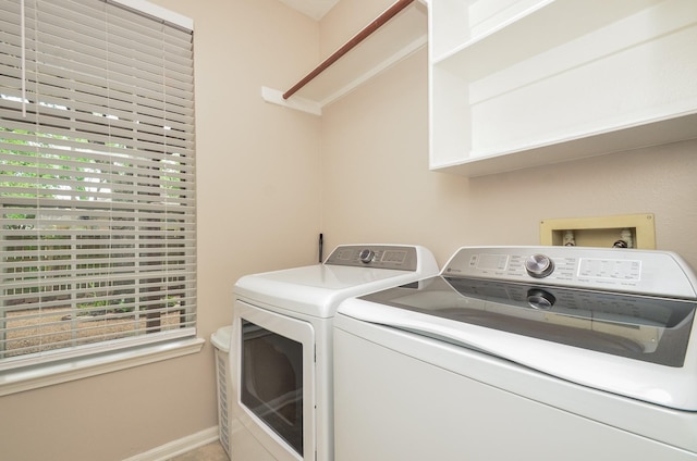 1501 Mulberry Ct, Pearland, TX 77581 - laundry area with washer and dryer and healthy amount of natural light
