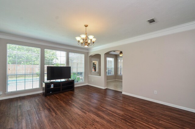 1501 Mulberry Ct, Pearland, TX 77581 - unfurnished living room with crown molding, arched walkways, a chandelier, dark wood-style floors, and plenty of natural light