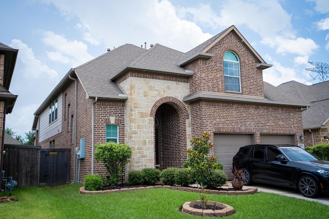 14907 Ashley Creek Ct, Humble, TX 77396 - view of front facade with brick siding, roof with shingles, and an attached garage