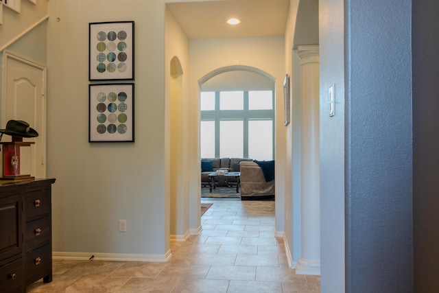 14907 Ashley Creek Ct, Humble, TX 77396 - hallway featuring arched walkways, light tile patterned flooring, and recessed lighting
