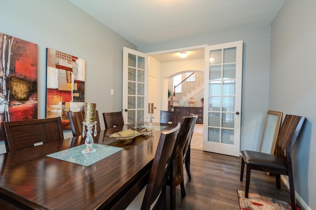 14907 Ashley Creek Ct, Humble, TX 77396 - dining space with french doors, dark wood-type flooring, and arched walkways