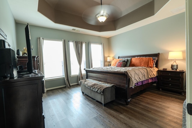 14907 Ashley Creek Ct, Humble, TX 77396 - bedroom featuring dark wood finished floors and a raised ceiling