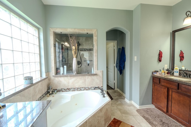 14907 Ashley Creek Ct, Humble, TX 77396 - full bath featuring a tub with jets, vanity, tiled shower, and tile patterned flooring
