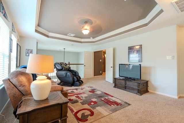 14907 Ashley Creek Ct, Humble, TX 77396 - carpeted living area with a tray ceiling, ornamental molding, and a ceiling fan