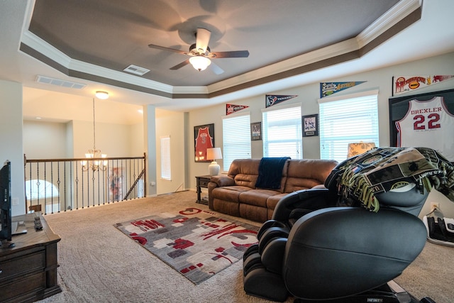14907 Ashley Creek Ct, Humble, TX 77396 - living room with crown molding, a raised ceiling, carpet floors, a chandelier, and ceiling fan