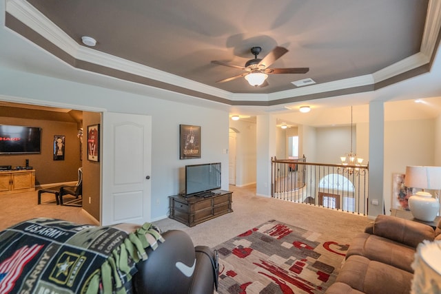 14907 Ashley Creek Ct, Humble, TX 77396 - living room with carpet flooring, ornamental molding, a raised ceiling, a ceiling fan, and a chandelier