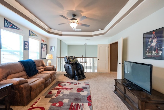14907 Ashley Creek Ct, Humble, TX 77396 - carpeted living room featuring a raised ceiling, ornamental molding, and ceiling fan