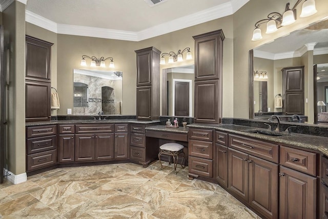 42015 Mill Creek Rd, Magnolia, TX 77354 - bathroom featuring ornamental molding, vanity, a shower, and stone finish floors