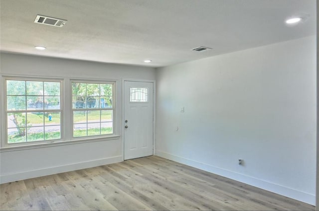 4934 Burma Rd, Houston, TX 77033 - entryway with light wood-style flooring and recessed lighting