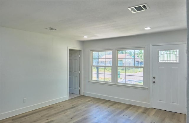 4934 Burma Rd, Houston, TX 77033 - entryway with light wood finished floors and recessed lighting