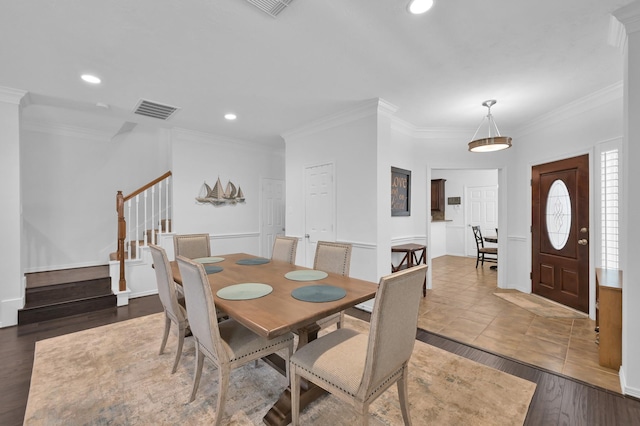 905 Wakefield Dr, Houston, TX 77018 - dining space featuring stairs, crown molding, recessed lighting, and wood finished floors
