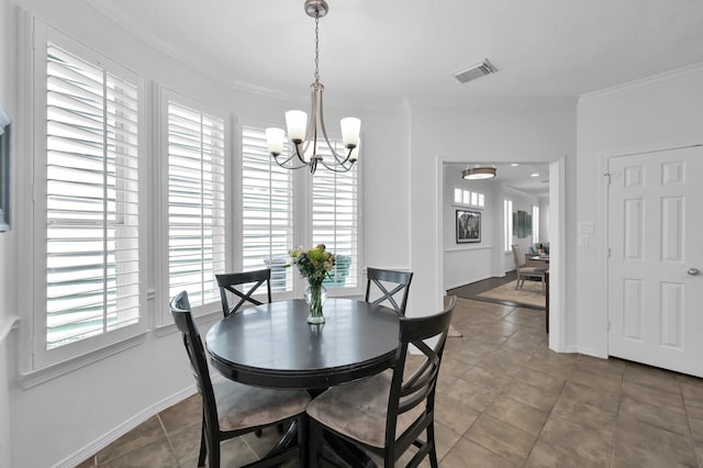 905 Wakefield Dr, Houston, TX 77018 - dining area featuring a chandelier, healthy amount of natural light, crown molding, and tile patterned flooring