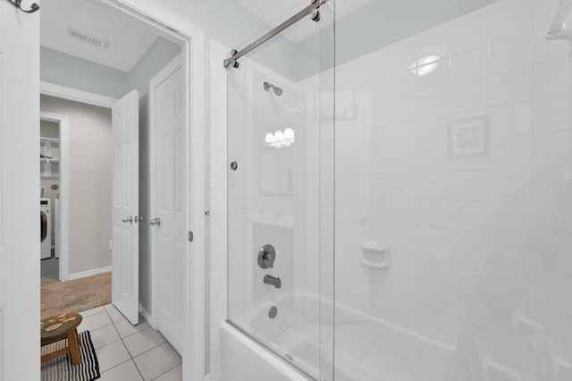 905 Wakefield Dr, Houston, TX 77018 - full bathroom with enclosed tub / shower combo, tile patterned floors, and washer / clothes dryer