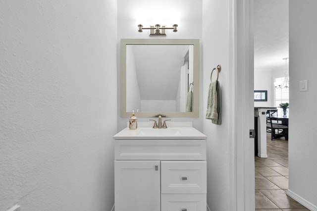 905 Wakefield Dr, Houston, TX 77018 - bathroom with a chandelier, vanity, and tile patterned floors
