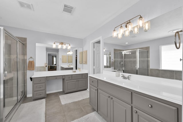 905 Wakefield Dr, Houston, TX 77018 - bathroom featuring two vanities, a chandelier, a stall shower, and tile patterned floors