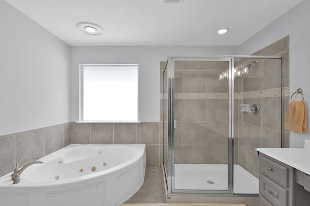 905 Wakefield Dr, Houston, TX 77018 - full bath featuring a tub with jets, a shower stall, vanity, and tile patterned floors