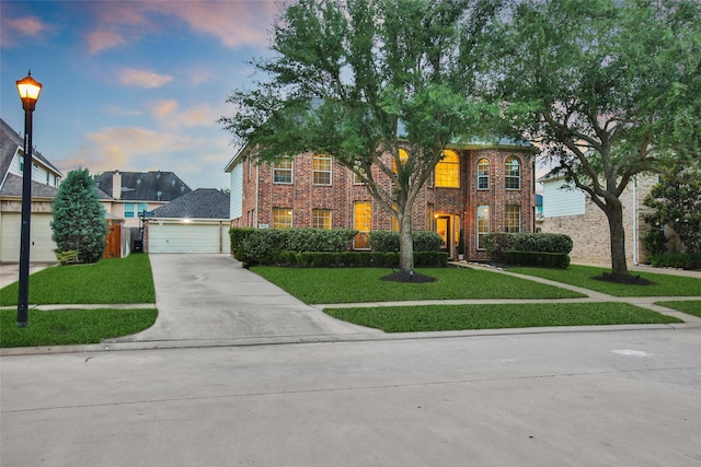 27115 Meadow Sage Ct, Cypress, TX 77433 - view of front of home with brick siding, a front yard, concrete driveway, and a garage