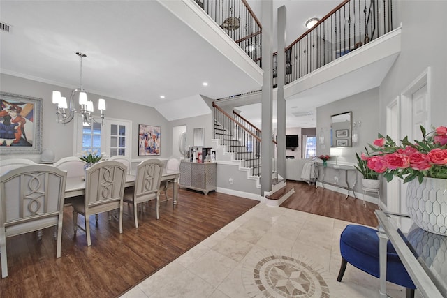 27115 Meadow Sage Ct, Cypress, TX 77433 - dining space featuring stairway, a chandelier, wood finished floors, and recessed lighting