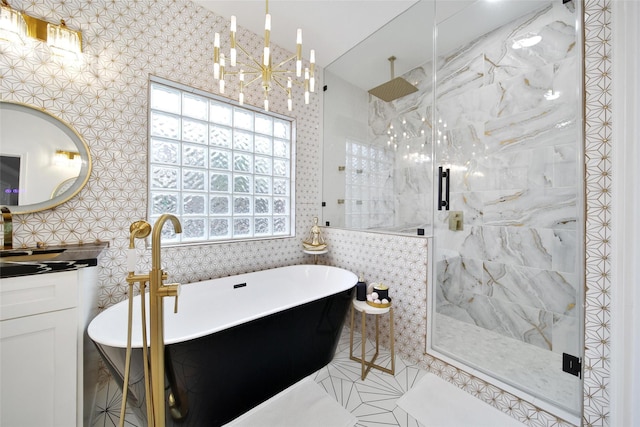 27115 Meadow Sage Ct, Cypress, TX 77433 - bathroom featuring a shower stall, vanity, tile walls, a chandelier, and a freestanding bath