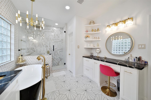 27115 Meadow Sage Ct, Cypress, TX 77433 - full bath with a chandelier, vanity, a marble finish shower, a soaking tub, and recessed lighting