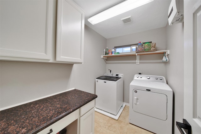 27115 Meadow Sage Ct, Cypress, TX 77433 - washroom featuring separate washer and dryer, cabinet space, and light tile patterned flooring
