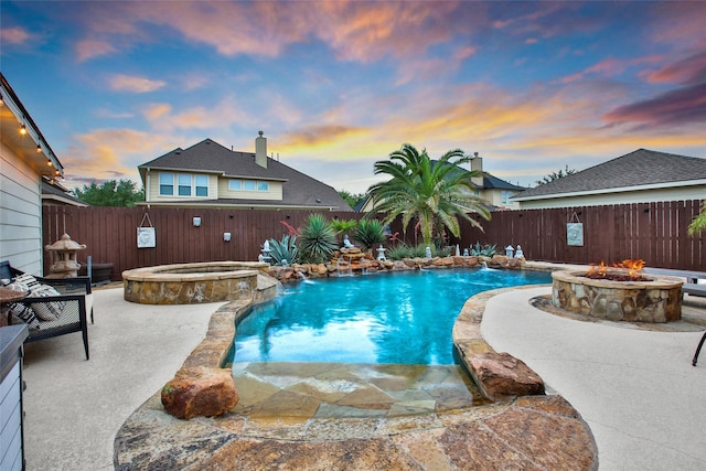 27115 Meadow Sage Ct, Cypress, TX 77433 - view of swimming pool with a fire pit, a fenced backyard, a pool with connected hot tub, and a patio area