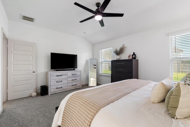14906 Rain Tree Dr, Baytown, TX 77523 - carpeted bedroom featuring multiple windows, vaulted ceiling, and ceiling fan