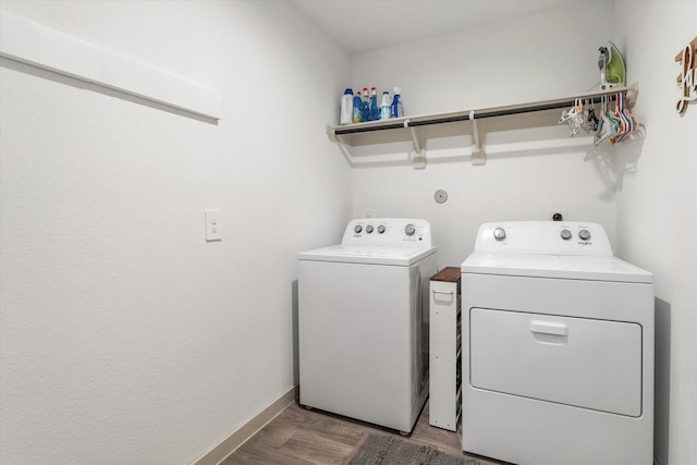 14906 Rain Tree Dr, Baytown, TX 77523 - washroom with washing machine and dryer and wood finished floors