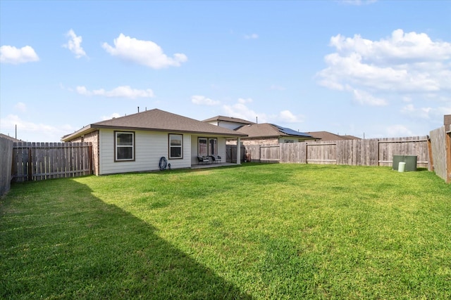 14906 Rain Tree Dr, Baytown, TX 77523 - rear view of house featuring a fenced backyard and a patio area