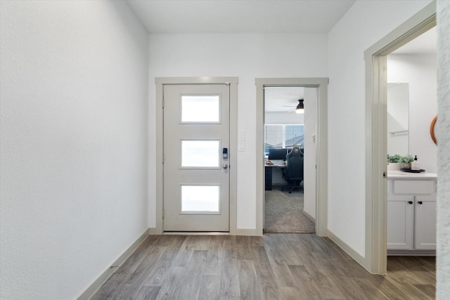 14906 Rain Tree Dr, Baytown, TX 77523 - entrance foyer with light wood-style floors and a ceiling fan