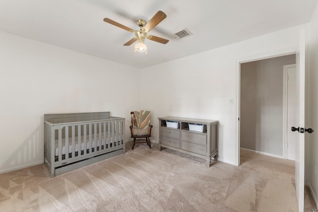 25607 Spring Ridge Dr, Spring, TX 77386 - carpeted bedroom with a crib and a ceiling fan