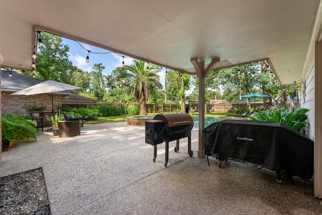 25607 Spring Ridge Dr, Spring, TX 77386 - fenced backyard featuring grilling area and a patio area