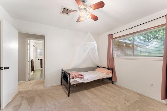 25607 Spring Ridge Dr, Spring, TX 77386 - carpeted bedroom with baseboards and ceiling fan