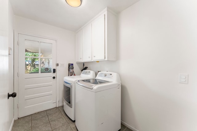 25607 Spring Ridge Dr, Spring, TX 77386 - laundry area featuring independent washer and dryer, cabinet space, and light tile patterned floors
