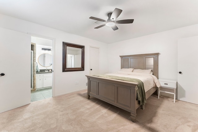 25607 Spring Ridge Dr, Spring, TX 77386 - bedroom featuring light colored carpet, ensuite bathroom, and a ceiling fan