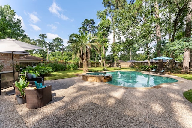25607 Spring Ridge Dr, Spring, TX 77386 - view of pool with a pool with connected hot tub, a patio area, and a fenced backyard