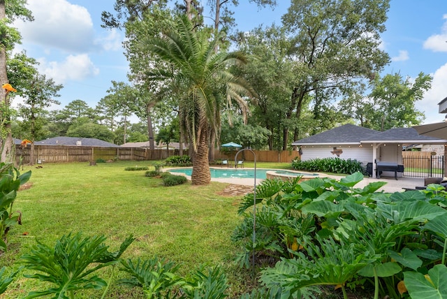 25607 Spring Ridge Dr, Spring, TX 77386 - fenced backyard with a patio and an in-ground hot tub
