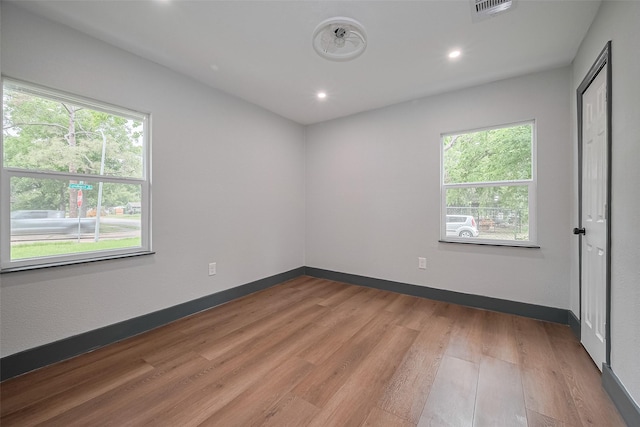 6058 Lyndhurst Dr, Houston, TX 77033 - spare room with light wood-type flooring and recessed lighting