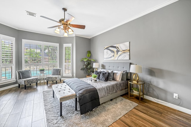 4602 Gladesdale Park Ln, Katy, TX 77450 - bedroom featuring crown molding, wood finished floors, and a ceiling fan