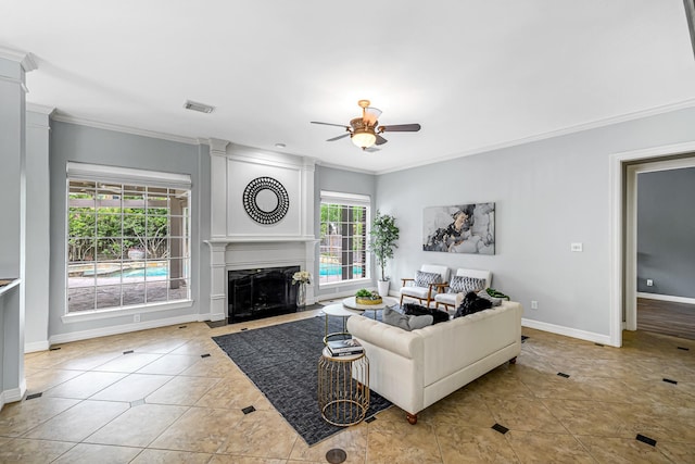 4602 Gladesdale Park Ln, Katy, TX 77450 - living area with ornamental molding, ceiling fan, tile patterned floors, and a fireplace
