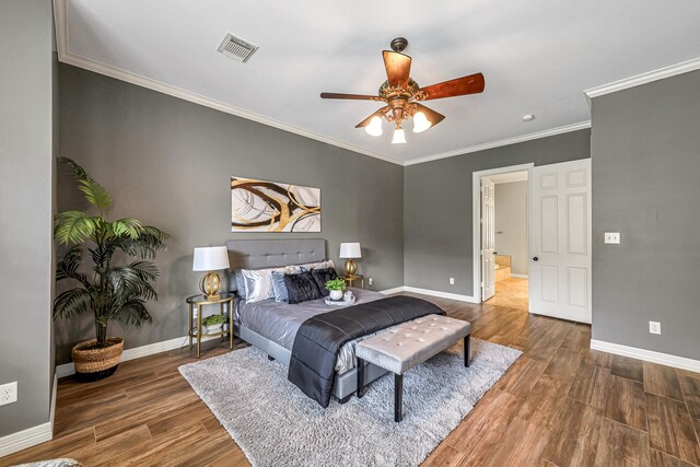 4602 Gladesdale Park Ln, Katy, TX 77450 - bedroom featuring wood finished floors, crown molding, ceiling fan, and connected bathroom