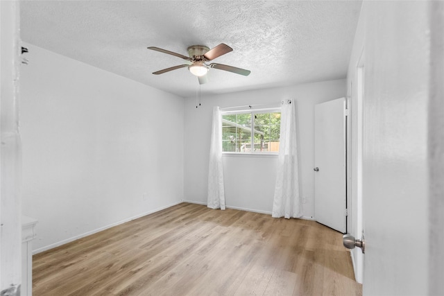 10507 Kirkhill Dr, Houston, TX 77089 - spare room featuring light wood-type flooring, a ceiling fan, and a textured ceiling