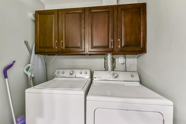 1311 Antoine Dr Unit 110, Houston, TX 77055 - washroom with cabinet space and washer and dryer