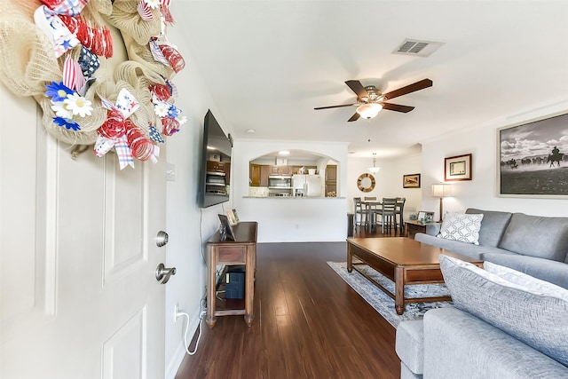 1311 Antoine Dr Unit 110, Houston, TX 77055 - living room featuring wood finished floors, ceiling fan, and arched walkways