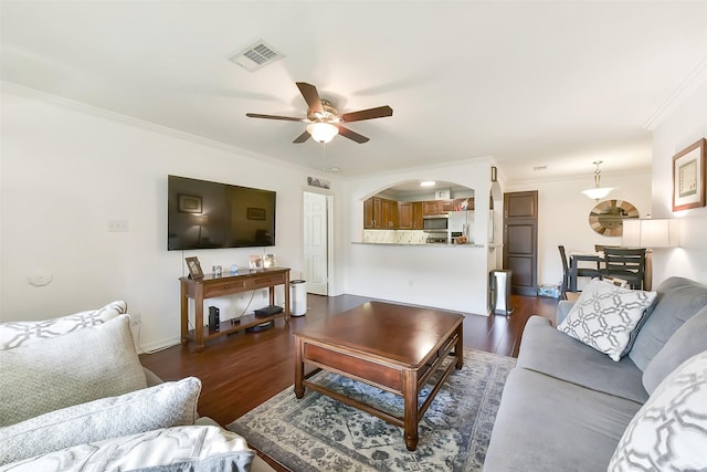 1311 Antoine Dr Unit 110, Houston, TX 77055 - living area with ornamental molding, a ceiling fan, dark wood-style floors, and arched walkways