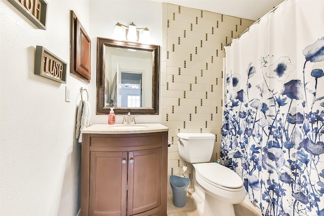 1311 Antoine Dr Unit 110, Houston, TX 77055 - bathroom featuring vanity, tile walls, a shower with curtain, and tile patterned floors